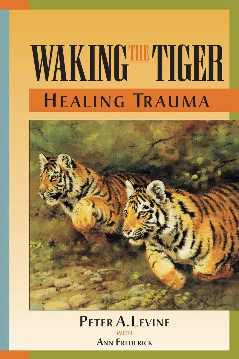 Book cover of “Waking the Tiger: Healing Trauma” by Peter A. Levine with Ann Frederick, featuring an illustration of two tigers walking through grass.